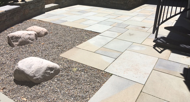 Stone patio with boulders recall galciers.