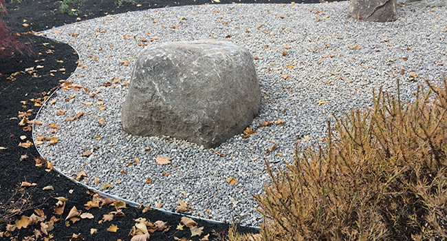 Japanese style gravel and boulder garden.